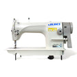 JUKI DDL-8700 Single Needle Lockstitch Industrial Sewing Machine with servo motor, table and stand included, displayed against a white background.