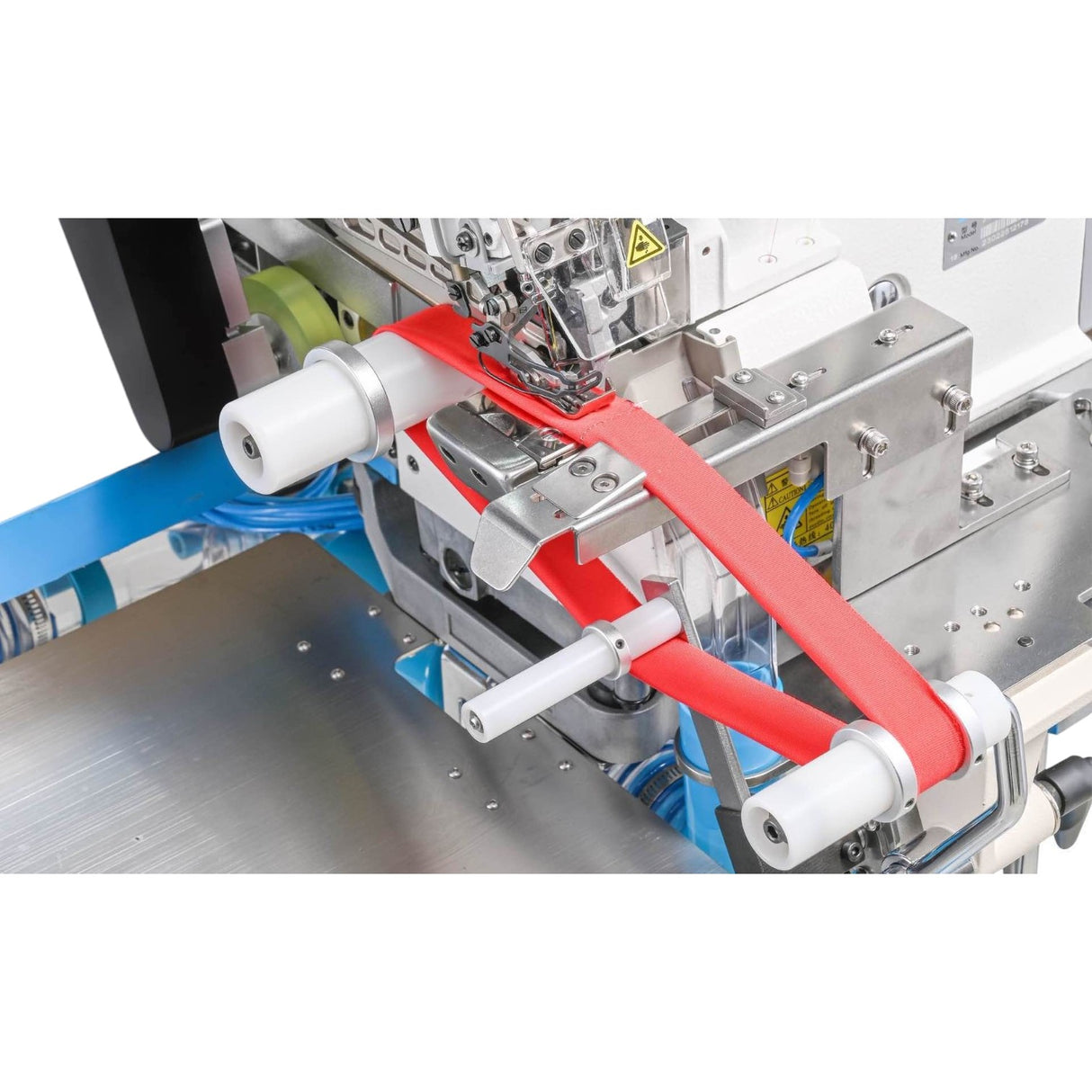 Supra Sewing Online, Llc industrial sewing machine attaching red collar to garment with photocell alignment and vacuum waste management.